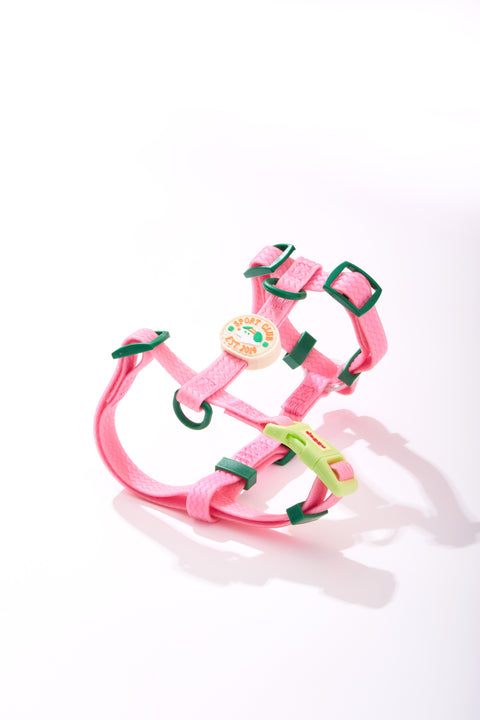 Doggu Sport Club waterproof dog harness in pink, laid flat to show the Y-front, back D-ring and lime lock buckle