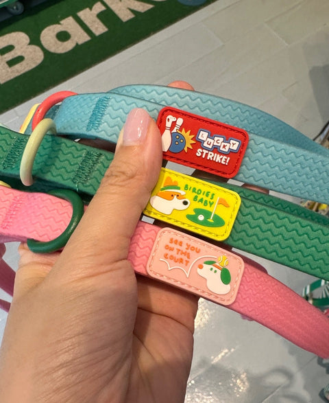 Doggu Sport Club leash patches close up: Lucky Strike bowling on blue, Birdies Baby golf on green and see you on the court tennis on pink
